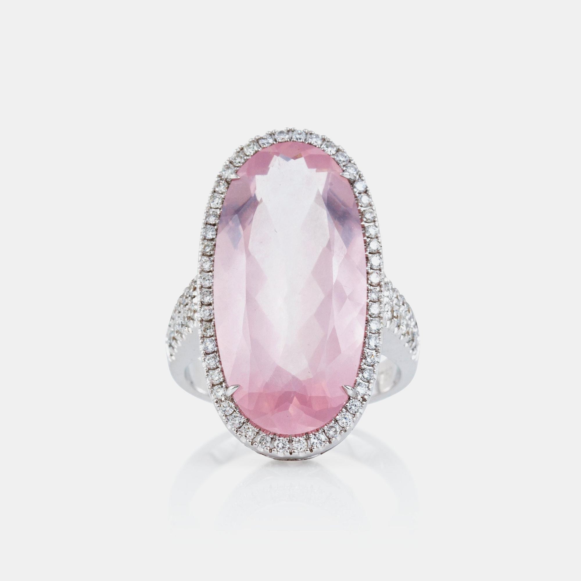 A rose quartz, circa 12.00 ct, and brilliant-cut diamond, circa 1.12 ct, ring.