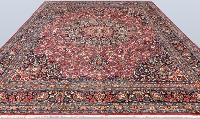 A semi-antique Meshed carpet, approx. 399 x 311 cm.