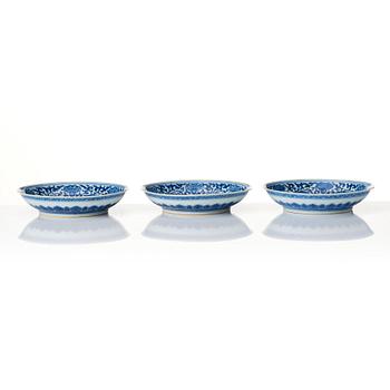 A set of three blue and white dishes, Qing dynasty with Qianlong seal mark.