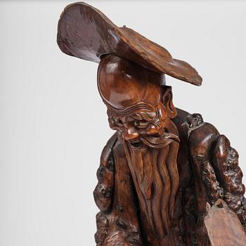 A large well sculptured root sculpture of 'Sholau and attendant', late Qing dynasty, 19th century.