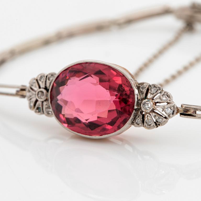 An 18K gold bracelet set with a faceted pink tourmaline weight ca 6.00 cts.