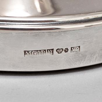 A pair of silver candelabra from MGAB, Uppsala, 1969-71.