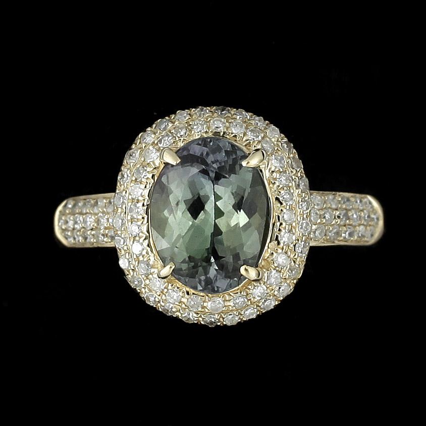 RING, 14k guld med grön zoisit enl certifikat ca2,12ct och små diamanter.. 2000-tal. Vikt 4g.
