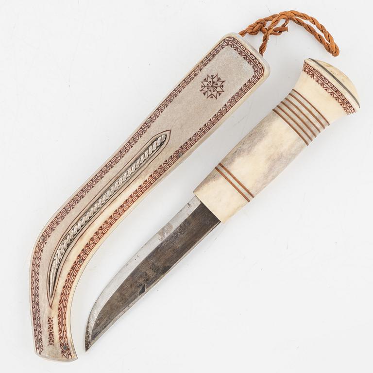 Esse Poggats, a reindeer horn knife, signed.