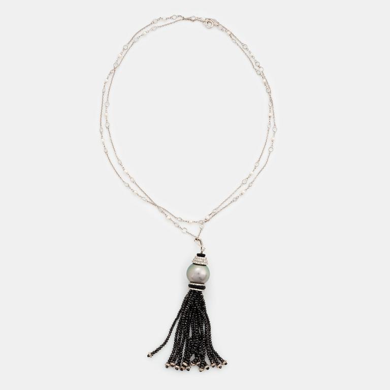 An Ebba Brahe 18K white gold tassel pendant with a cultured Tahitian pearl and white and black diamonds.