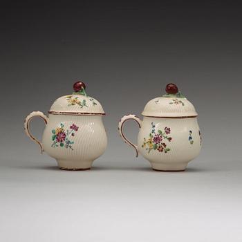 A pair of Swedish soft paste custard cups with covers, Marieberg, 18th Century.