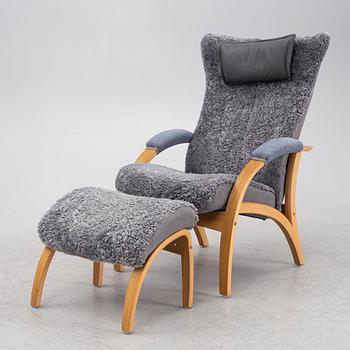 A 'Delta Adventure' armchair with ottoman, Brunstad, Norway.