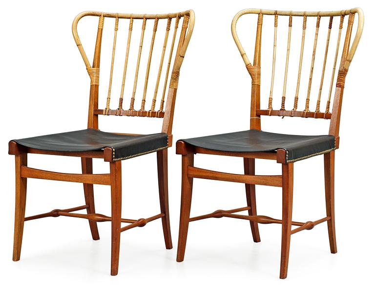 A pair of Josef Frank mahogany, bamboo and black leather chairs, Svenskt Tenn, model 1179.