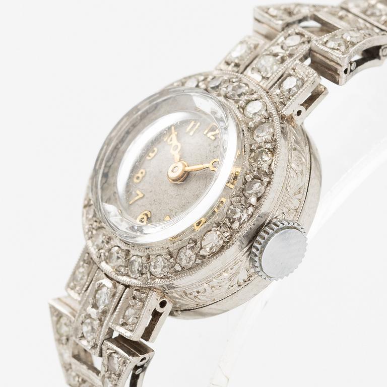 Damarmbandsur, platina med åttkantslipade diamanter, med textilrem.