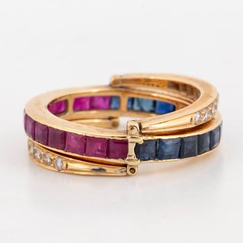 Calibre-cut ruby and sapphire and brillint-cut diamond ring.