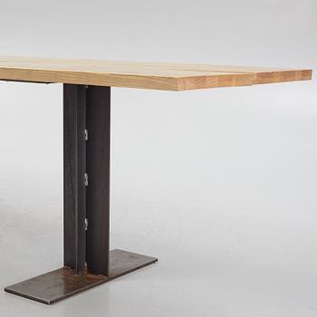 An ash and iron dining table by Sävar snicker.