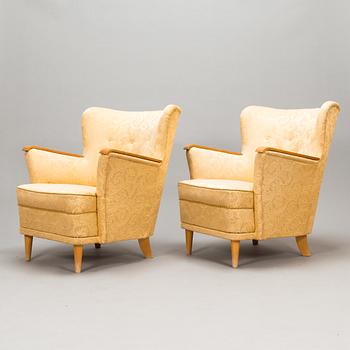 A pair of 1950's armchairs.