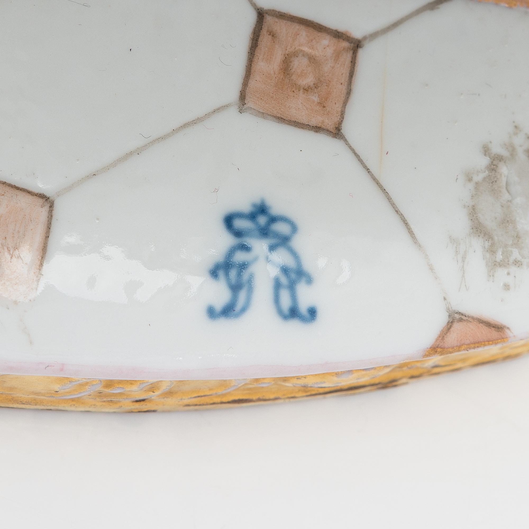 A Volkstedt porcelain musical trio figurine, mid-20th century. Length 40 cm.