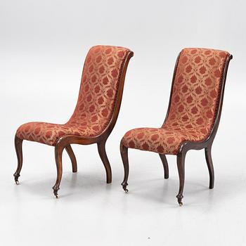 A pair av easy chairs, 19th Century.