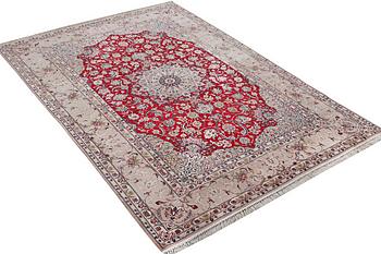 An Esfahan carpet, part silk, signed Rahmi, c. 298 x 206 cm.