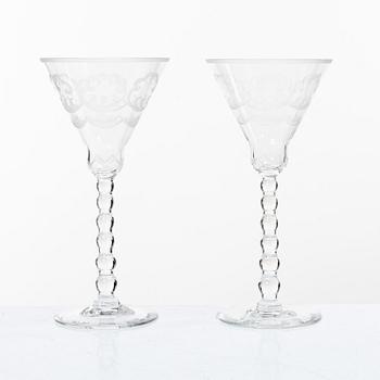 Simon Gate, nine "Molnet" red wine glasses, Orrefors.
