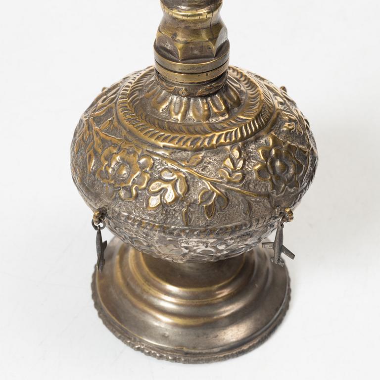 An 20th century british Raj repoussé metal rosewater sprinkler.