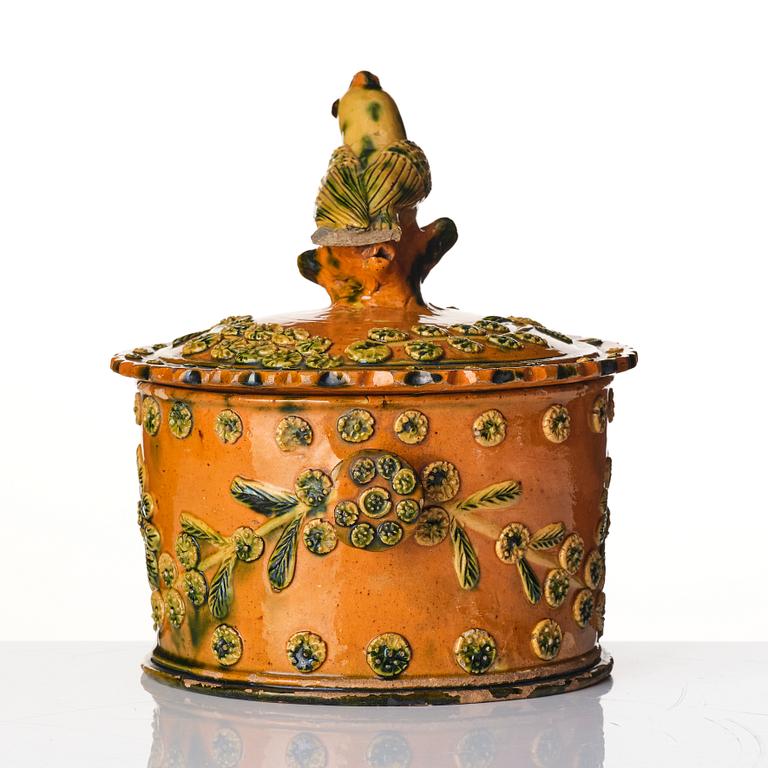 A glazed earthenware jar with cover, probably France, 19th century.