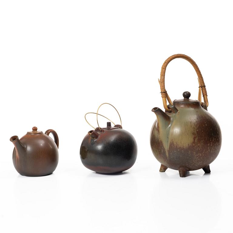 Gösta Grähs, , Gunnar Nylund and Carl-Harry Stålhane, three stoneware teapots, Rörstrand.