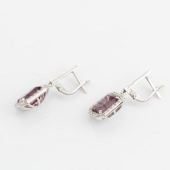 Purple tourmaline and brilliant cut diamond earrings.