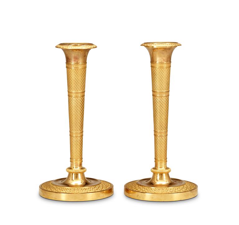 A pair of French Empire early 19th Century candlesticks.