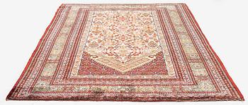 A semi-antique silk Qum rug, central Persia 221 x 138 cm.