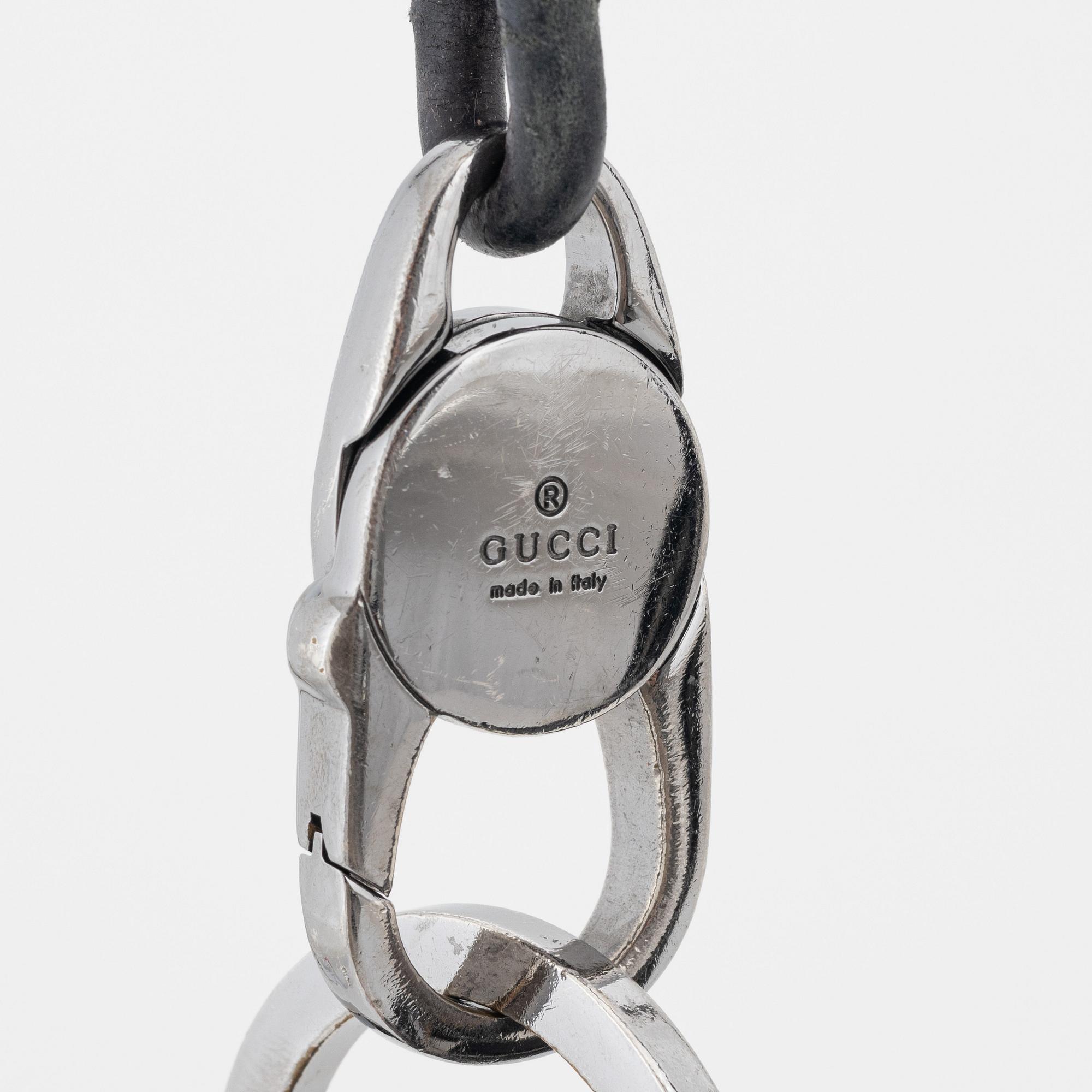 Gucci, a leather bag.