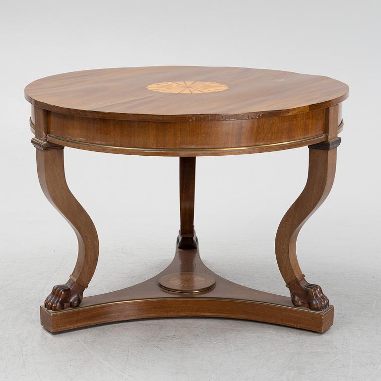 A mahogany veneered Empire style table, first half the 20th Century.