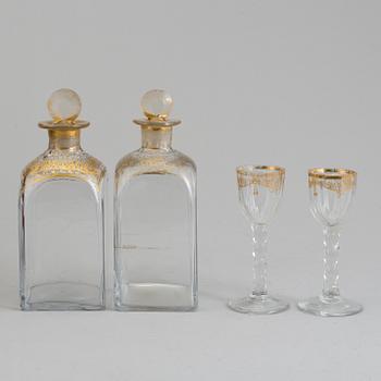A first half of the 19th century wooden casket containing 6 flasks 2 glasses.