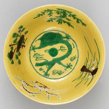 A pair of yellow ground 'dragon bowls', Qing dynasty, with Kangxis six character mark.