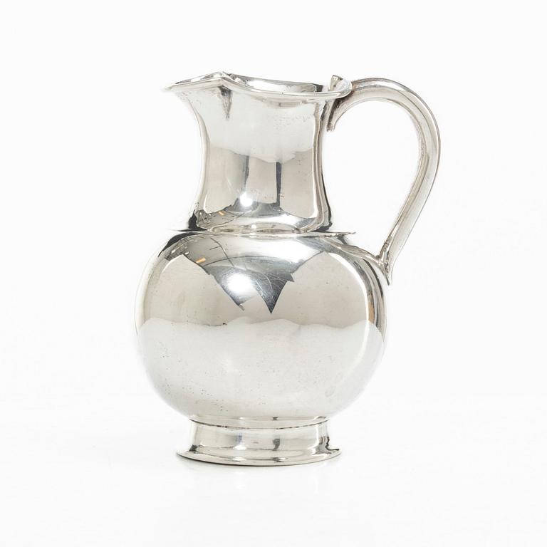 A British silver creamer, mark of Henry John Lias & Son, London 1875.