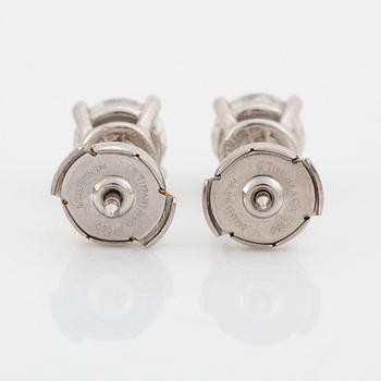 A pair of Tiffany solitaire diamond stud earrings in platinum.