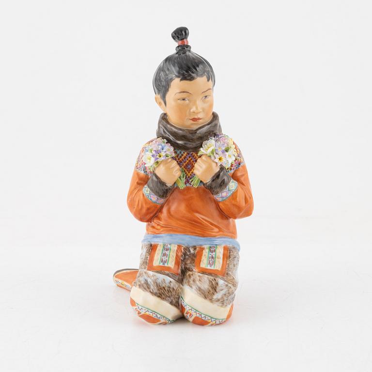 A Royal Copenhagen porcelain figure of an innuit from Grönland, Denmark, early 20th Century.