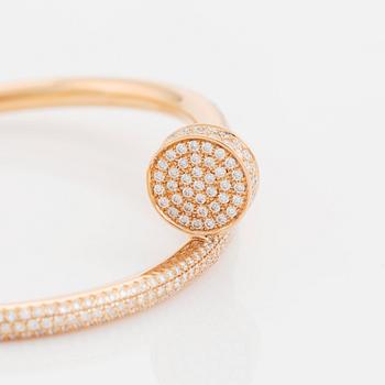 A Cartier "Juste en Clou" bracelet in 18K rose gold set with round brilliant-cut diamonds.