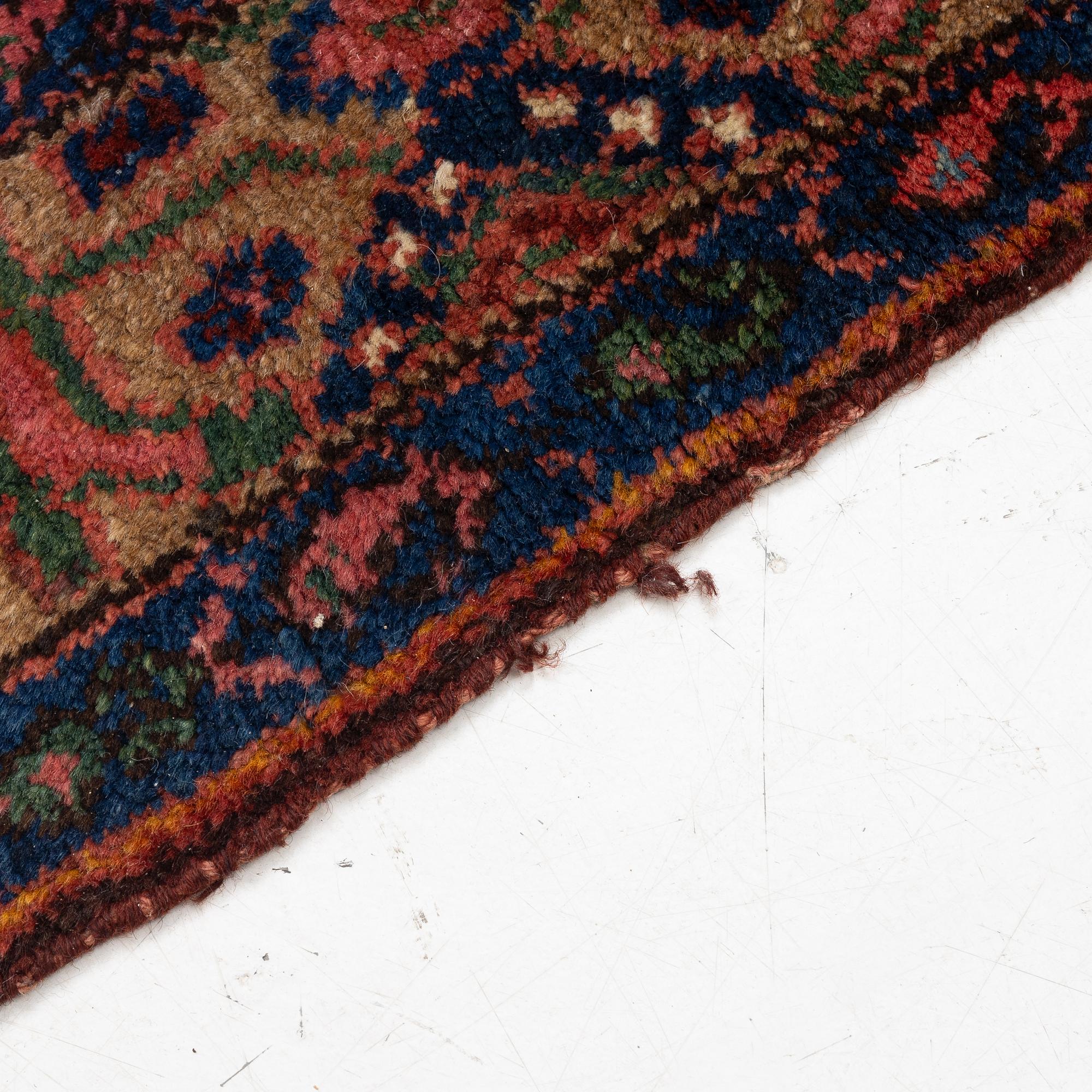 A semi-antique Northwest Persian runner, c. 388 x 94 cm.