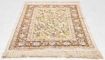 A silk an metal Hereke rug, West Anatolia, c. 100 x 68 cm.