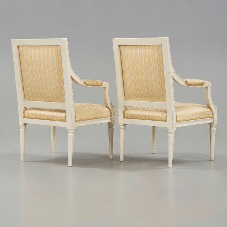 A pair of Gustavian late 18th century armchairs in the manner of Johan Lindgren.