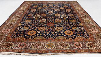 A semi-antique Tabriz carpet, c. 395 x 295 cm.