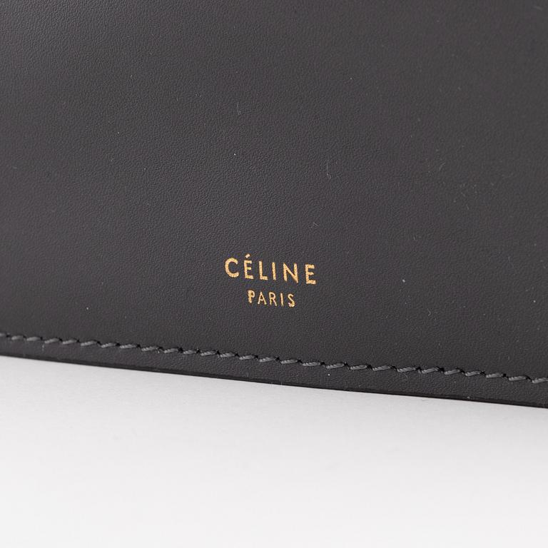 Céline, a grey leather handbag.