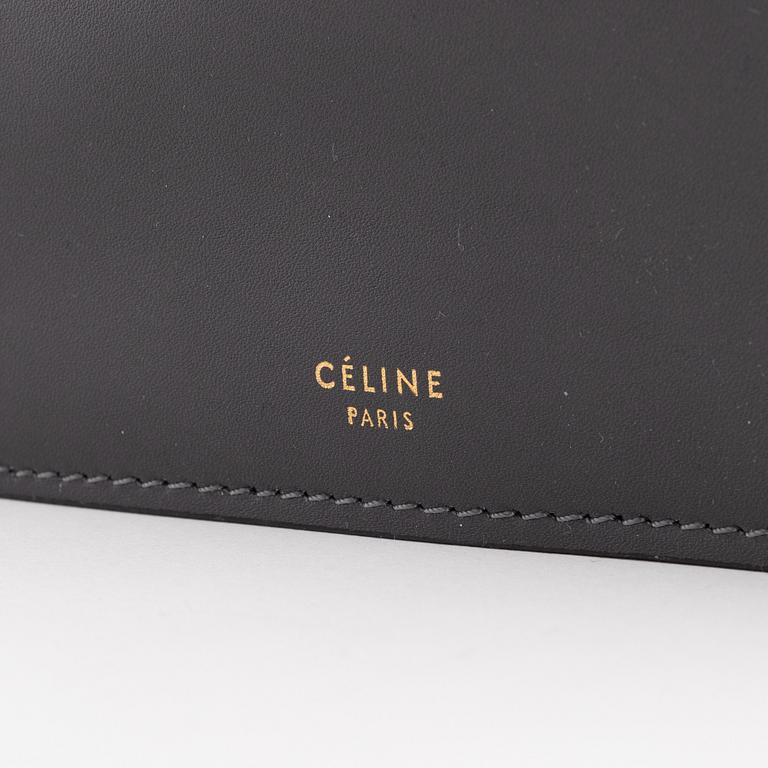 Céline, a grey leather handbag.