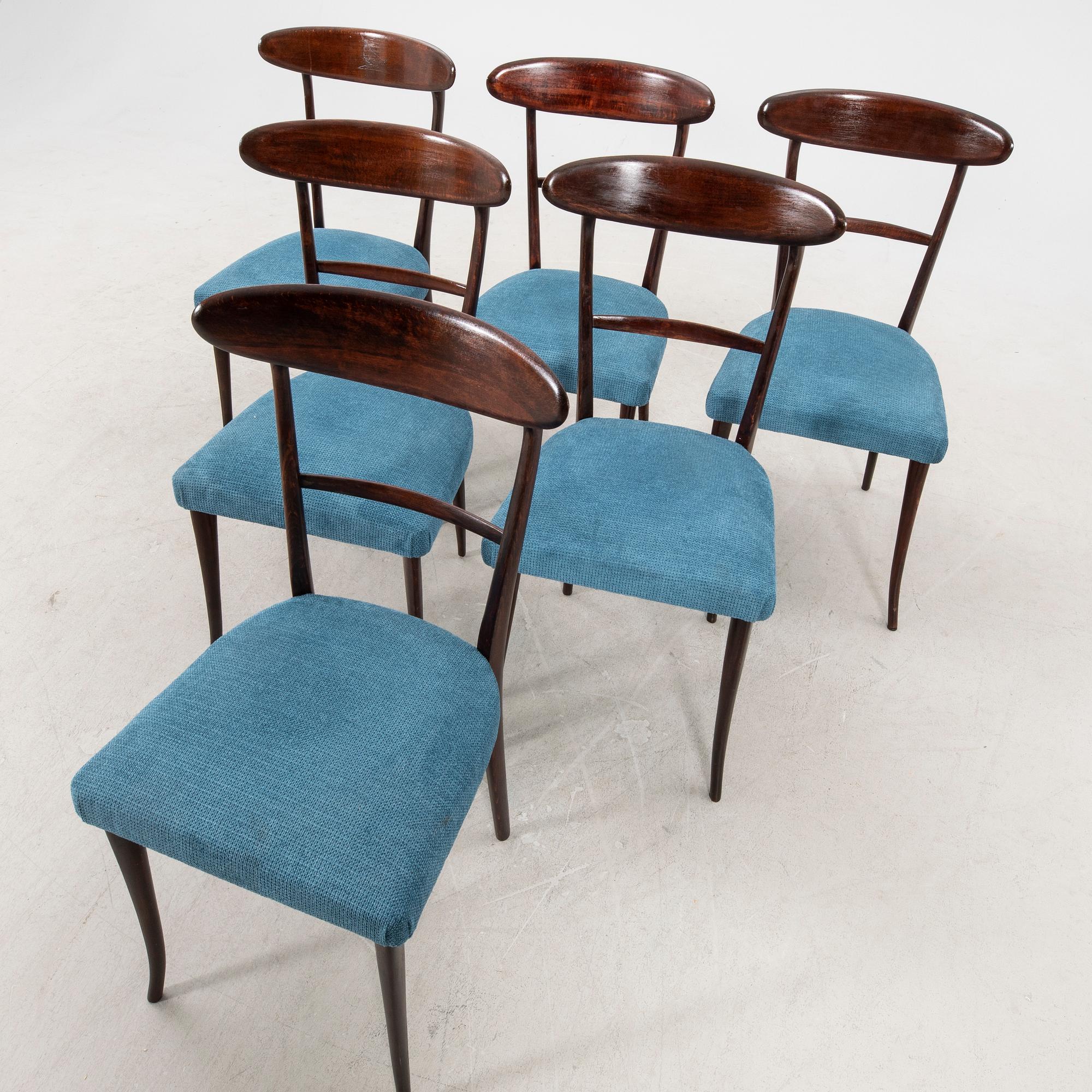 A set of six Italian Mid 1900s walnut chairs.