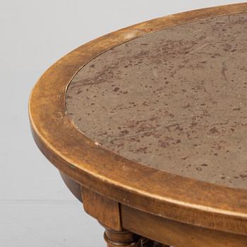 A stone top coffee table. First half of the 20th Century.