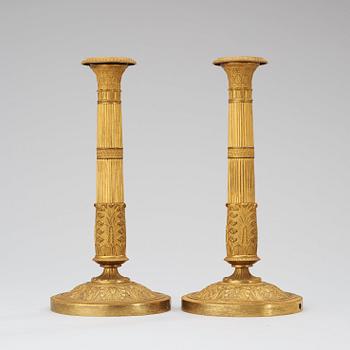 A pair of French Empire early 19th century candlesticks.