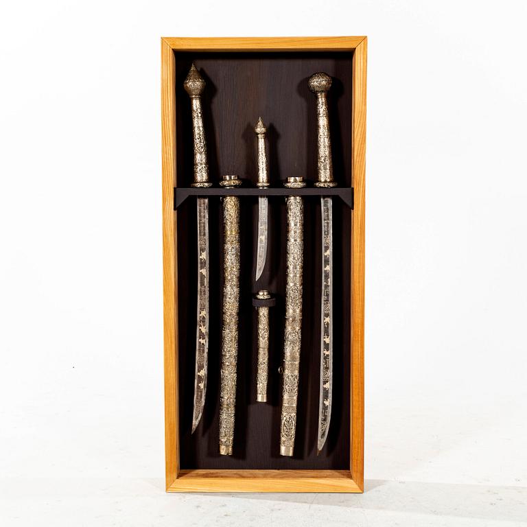 A set of three Burmese 'Dha' swords, late 19th /early 20th Century.