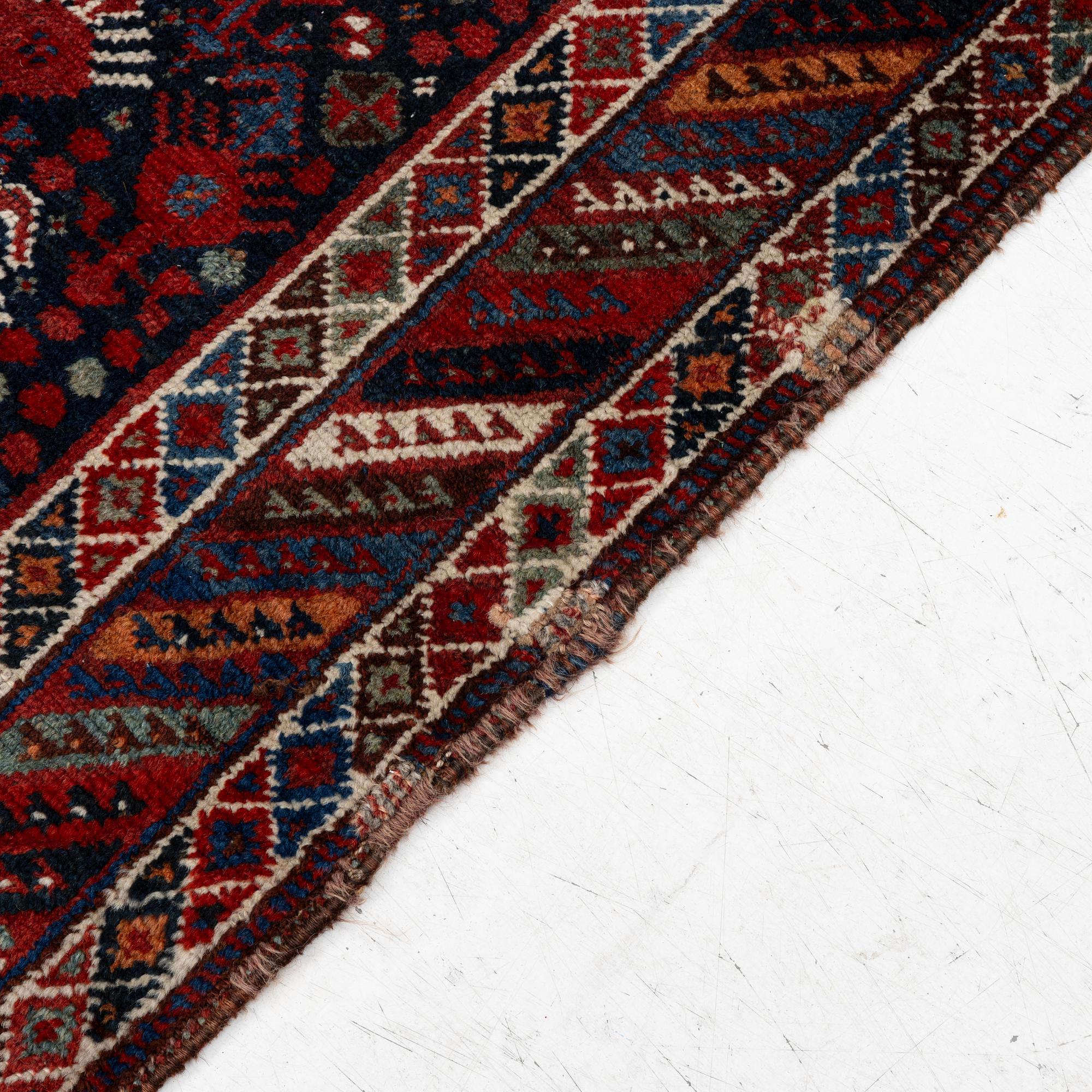 An antique Qashgai rug, 230 x 135 cm.