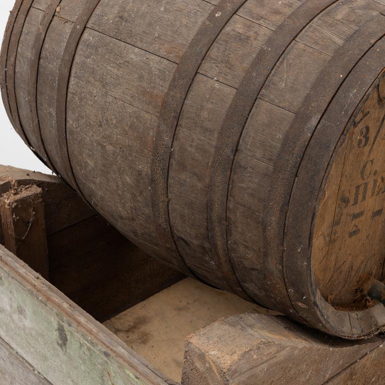 A pair of oak wine casks on stands, early 20th century.