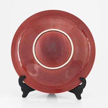 Wilhelm Kåge, a red glazed stoneware 'Argenta' dish, Gustavsberg, Sweden 1956.