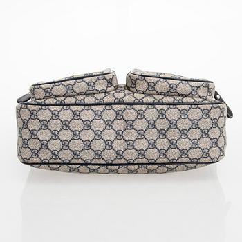 Gucci, A "GG Supreme messenger" bag.