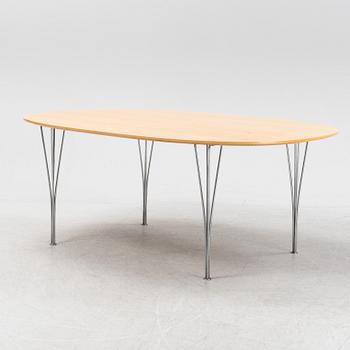 A 'Super elliptical' dining table by Bruno Mathsson & Piet Hein for Fritz Hansen.