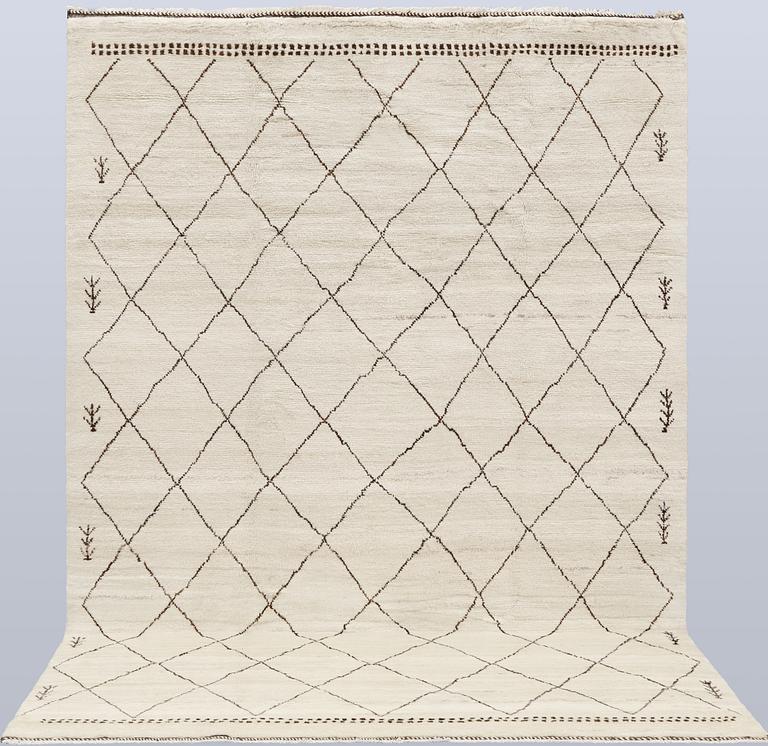 A Moroccan rug, c. 290 x 197 cm.